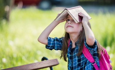 Schoolgirl with a book. Education, lifestyle concept