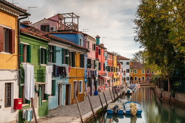 Fototapeta na wymiar Reflection of colourful houses on the island of Burano