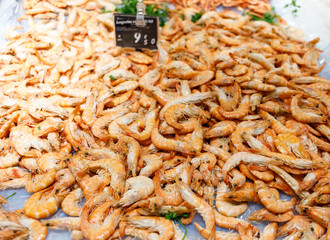 Shrimps. Fresh Prawns close-up. Seafood rotated on crashed ice, food background, top view, preparing healthy food, cooking, diet, nutrition concept.