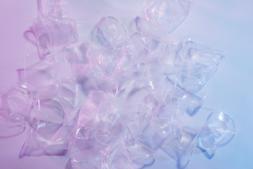 Plastic waste, Plastic cups on light background.