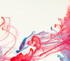 Color drop in water on a white background close-up, abstraction