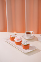 homemade cupcakes decorated with cream cheese frosting 