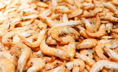 Shrimps. Fresh Prawns close-up. Seafood rotated on crashed ice, food background, top view, preparing healthy food, cooking, diet, nutrition concept.
