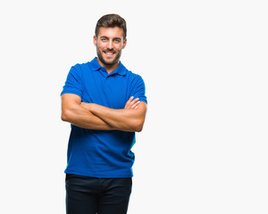 Young handsome man over isolated background happy face smiling with crossed arms looking at the...