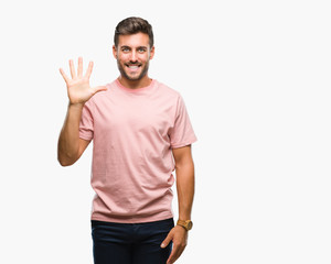 Fototapeta premium Young handsome man over isolated background showing and pointing up with fingers number five while smiling confident and happy.