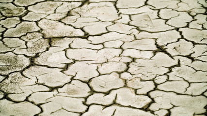 Dry cracked soil, Arid climate. Volcanic landscape around volcano. mountainous relief after volcanic eruption