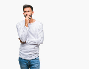 Fototapeta premium Adult hispanic man over isolated background thinking looking tired and bored with depression problems with crossed arms.