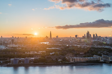 The sun sets over the City of London, London