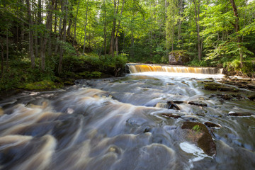 Cascades on the river shoy with a long exposure. Forest wet mood of Estonia.