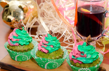 Christmas cupcakes - homemade cupcakes with spinach and ricotta cream decorated with green and pink cream. Christmas and New Year dessert. Sugar free, gluten free pastry.