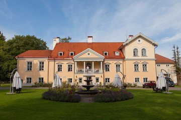 Fototapeta na wymiar An old manor Vihula in Estonia, Lahemaa park. Beautiful summer landscape with pond