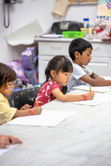 Fototapeta premium Young children drawing