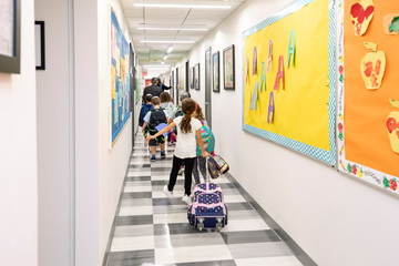Children walking through a school hallway © Ashok Sinha