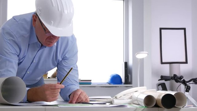 Businessman In Company Office Write Technical Documentation and Make Calculation