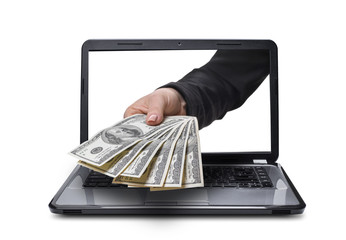 hand with money coming out of laptop