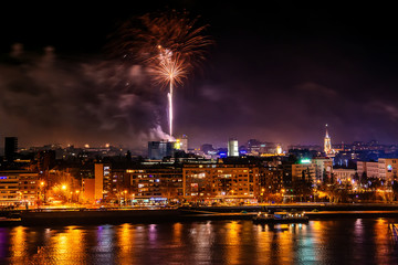 Fototapeta na wymiar Novi Sad, Serbia - January 01, 2019: Fireworks in Novi Sad, Serbia. New Year`s fireworks.