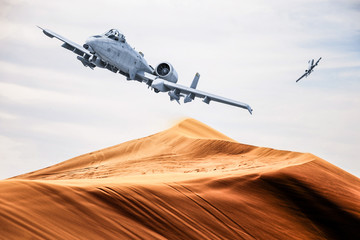 two american warplanes flies over a desert