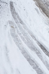 traces in the snow of tires winter day