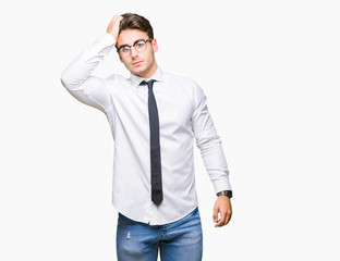 Young business man wearing glasses over isolated background Smiling confident touching hair with hand up gesture, posing attractive