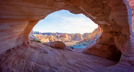 Arch Canyon window to the Valley with the bluesky and colorful sandstone reflection with sunray - obrazy, fototapety, plakaty