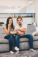 Fototapeta na wymiar Husband and woman sitting on the couch