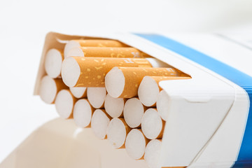 Open blue pack of cigarettes isolated on white