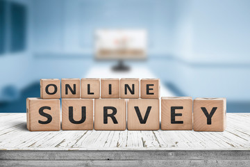 Online survey sign on a table in a blue room