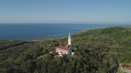 Fototapeta na wymiar Aerial view of Lighthouse on hill. Cape Bojeador Lighthouse, Burgos, Ilocos Norte, Philippines.
