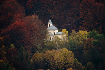 old church immersed in the autumn forest