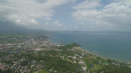 Aerial view city Legazpi in background Mayon volcano. Tropical landscape city near volcano on seashore, Philippines, Luzon.