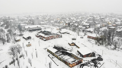 Aerial view of fire destroyed factory, winter time. Drone photography