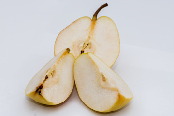 The slices of  organic pear on the white background