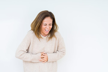Beautiful middle age woman over isolated background with hand on stomach because indigestion, painful illness feeling unwell. Ache concept.