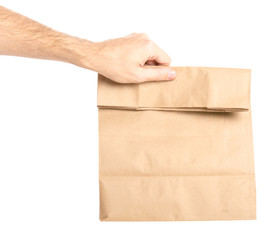 Package bag delivery in hand on white background isolation