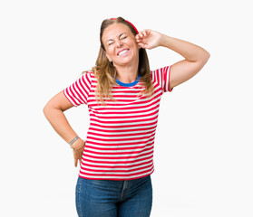Beautiful middle age woman wearing casual stripes t-shirt over isolated background stretching back, tired and relaxed, sleepy and yawning for early morning