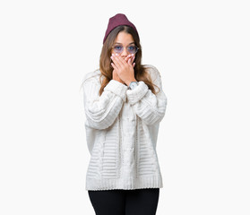 Young beautiful brunette hipster woman wearing sunglasses over isolated background shocked covering mouth with hands for mistake. Secret concept.