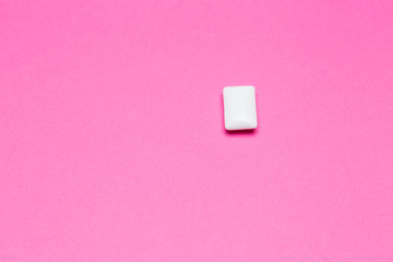 Chewing gum close up on a pink background