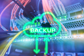 Backup button on modern server room background. Data loss prevention. System recovery.