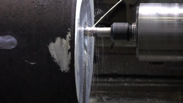 Drilling holes in workpiece on machine