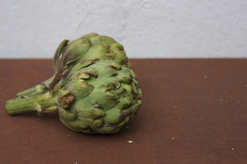 Two side artichokes with space to place some text