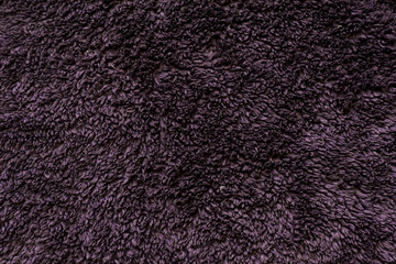Bathrobe and towel ultra violet terry cloth texture. Abstract background.
