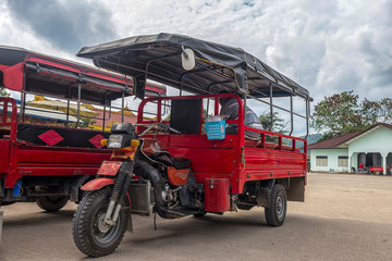 Traditional red tuk tuk from Myanmar, Burma.