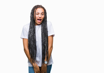 Young braided hair african american girl over isolated background winking looking at the camera...