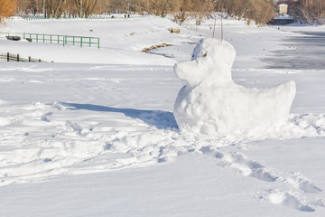 Snow duck sculpture in the winter park