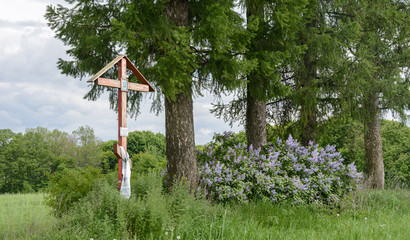 In place of the old church stands a cross and grow larch. The church is destroyed.