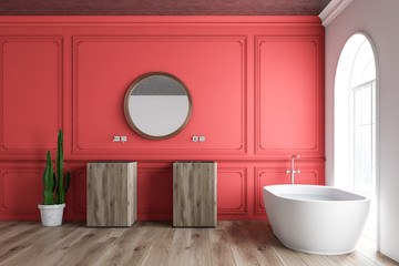 Red bathroom interior, tub and sinks