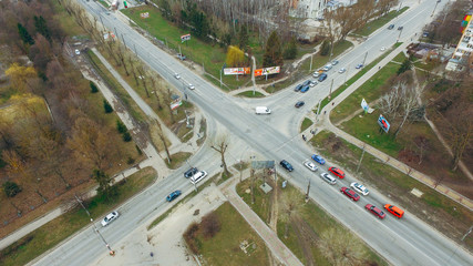 Cars stand at the intersection near the sphetophor. Air view.