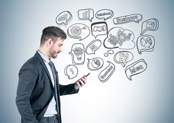 Businessman with phone, business goal