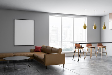 Gray living room, sofa and poster