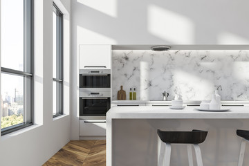 White and marble kitchen with bar close up